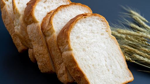 Sliced bread with wheat.