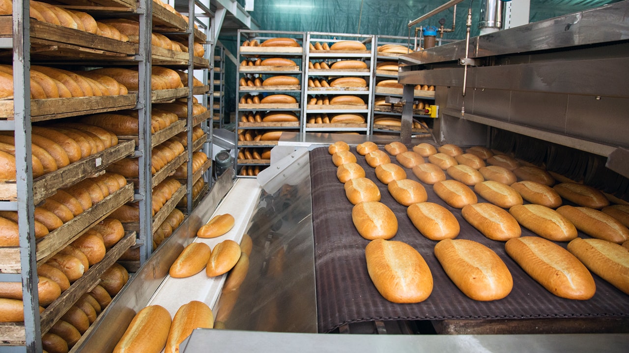 Racks of freshly baked bread.