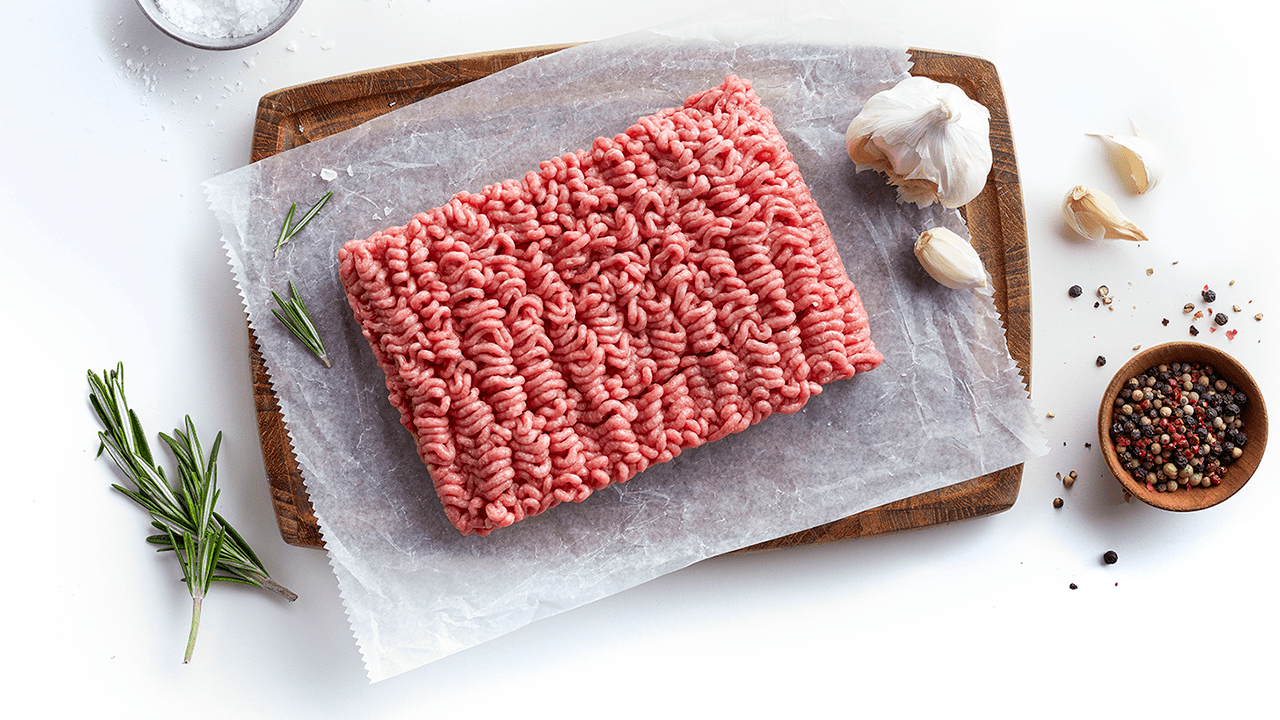 Ground beef and spices on board.